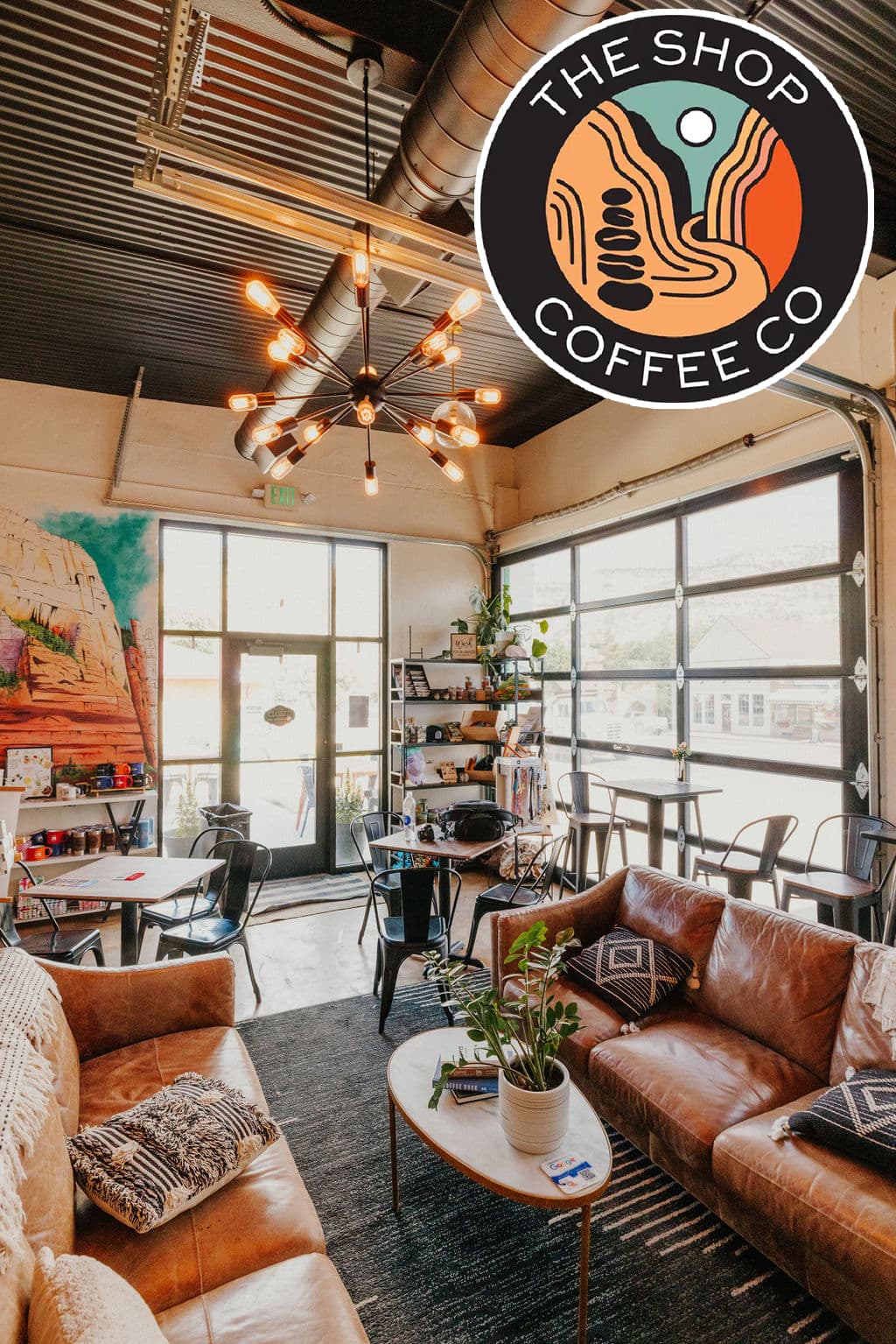 Cozy coffee shop interior featuring leather seating, a vibrant mural, and modern decor.