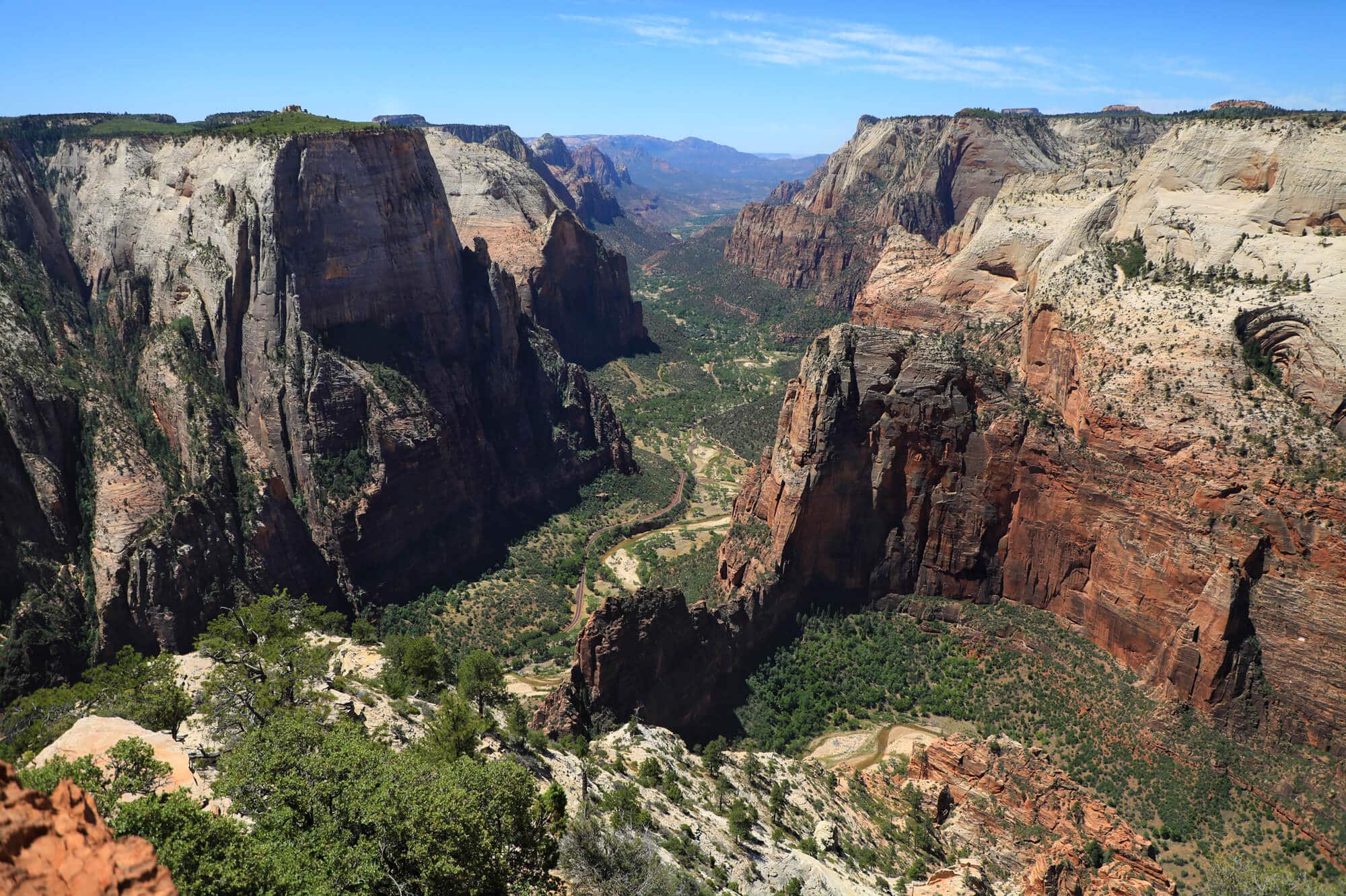 A panoramic view of Zion National Park's dramatic sandstone cliffs and valleys.