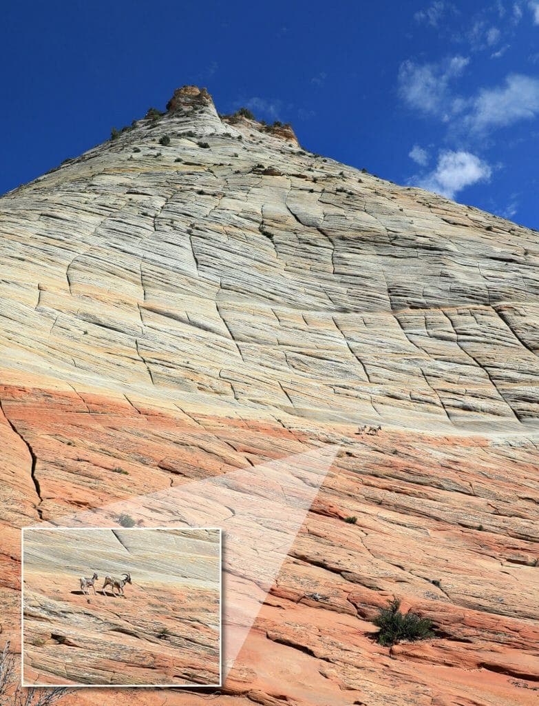 A dramatic rock formation with colorful stripes and a zoomed-in view of goats navigating the steep slope.