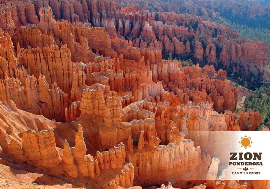 Aerial view of stunning orange rock formations in a canyon landscape.
