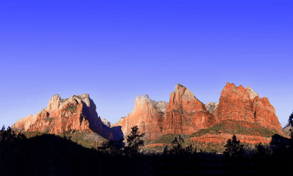 Red rock formations under a clear blue sky.