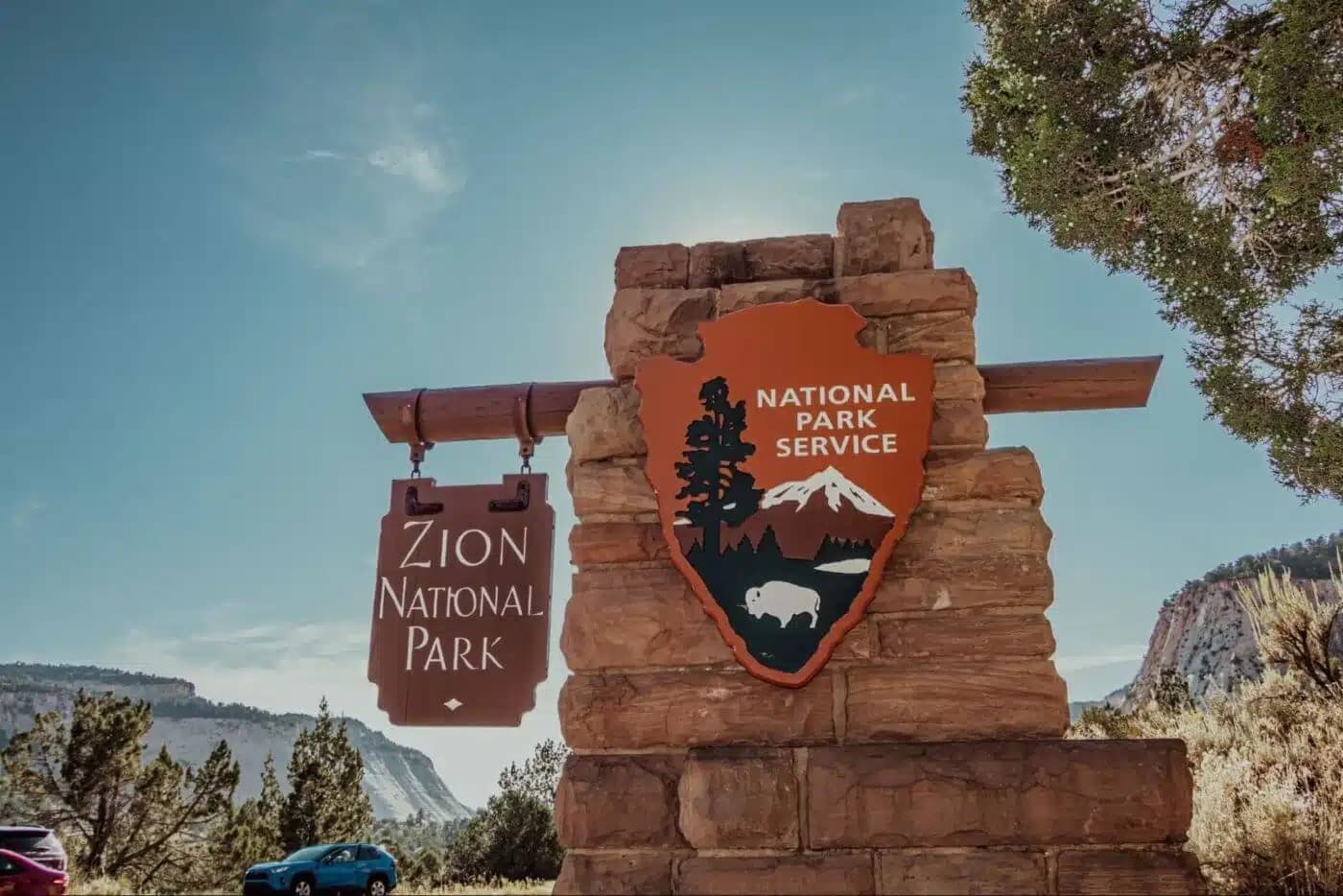 Sign for Zion National Park featuring the National Park Service emblem.