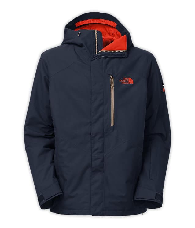 A navy blue jacket with an orange inner lining and the North Face logo.