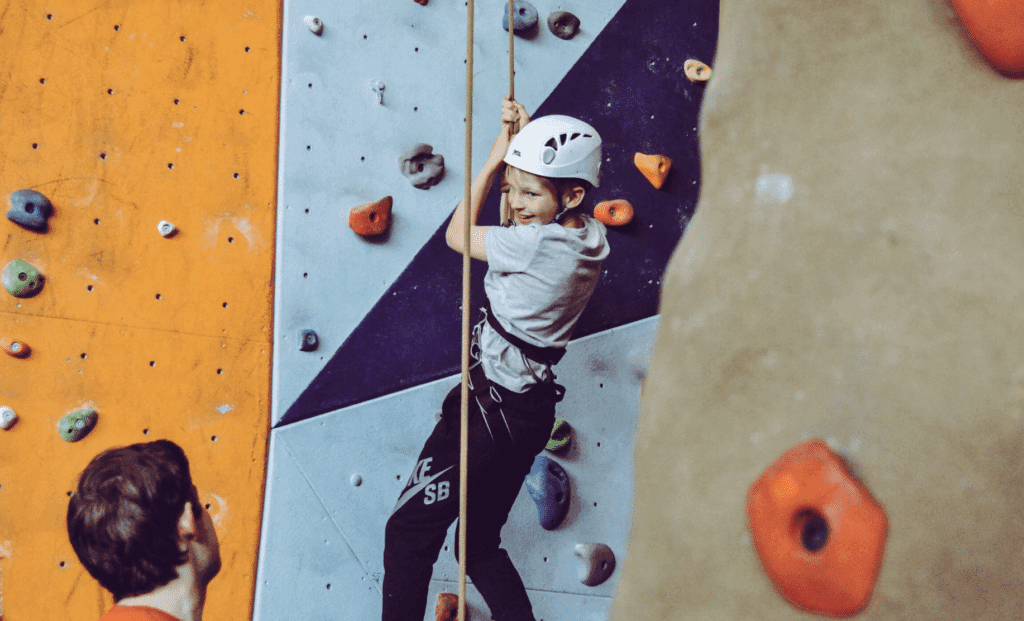 A child on a climbing wall at Zion Ponderosa