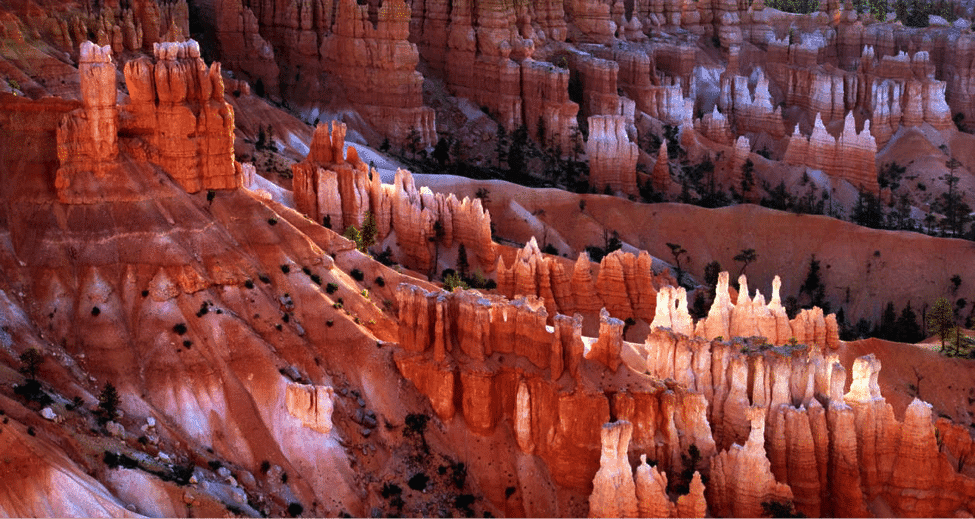 A panoramic view of colorful rock formations in a canyon.