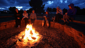 Campers sitting around the campfire