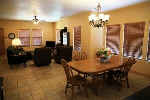 a tiled family and dining room inside of a vacation home at Zion Ponderosa Ranch