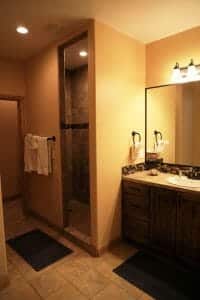 a clean tiled bathroom and shower room inside of a vacation home at Zion Ponderosa Ranch