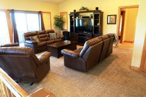 a clean and comfortable living room inside of a vacation home at Zion Ponderosa Ranch