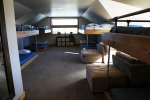 A group accommodation room with 4 sets of double bunk beds inside of a vacation home at Zion Ponderosa Ranch