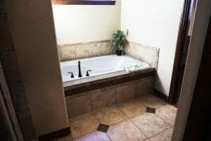 a tiled bath room with a jet tub inside of a vacation home at Zion Ponderosa Ranch