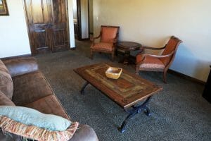 a clean living room inside of a vacation home at Zion Ponderosa Ranch