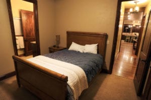 a bedroom with a double bed has a private bathroom in a vacation home near Zion National Park