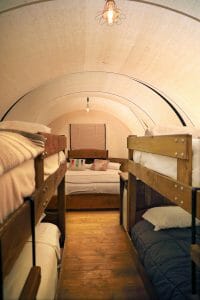 wagon tent glamping near zion national park with 2 bunk beds and a king sized bed