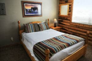 a full sized bed in a cabin at zion ponderosa ranch