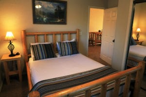 a full sized bed in a vacation house at zion ponderosa ranch