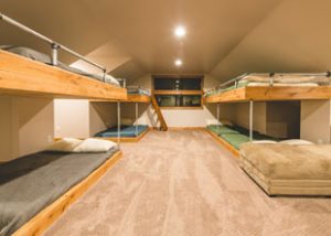 The loft of Rental home C has many bunkbeds