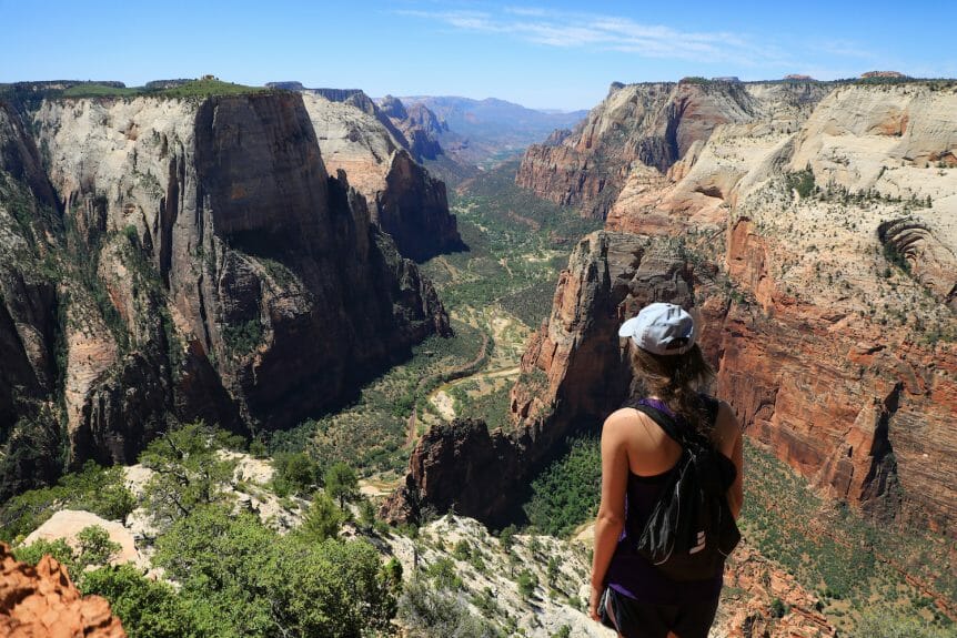 woman standing on angels landing in zion national park