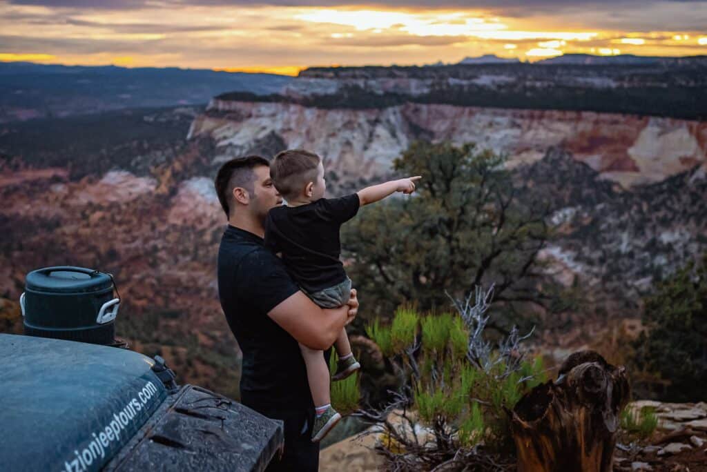 Father and son watching the sun set in Zion