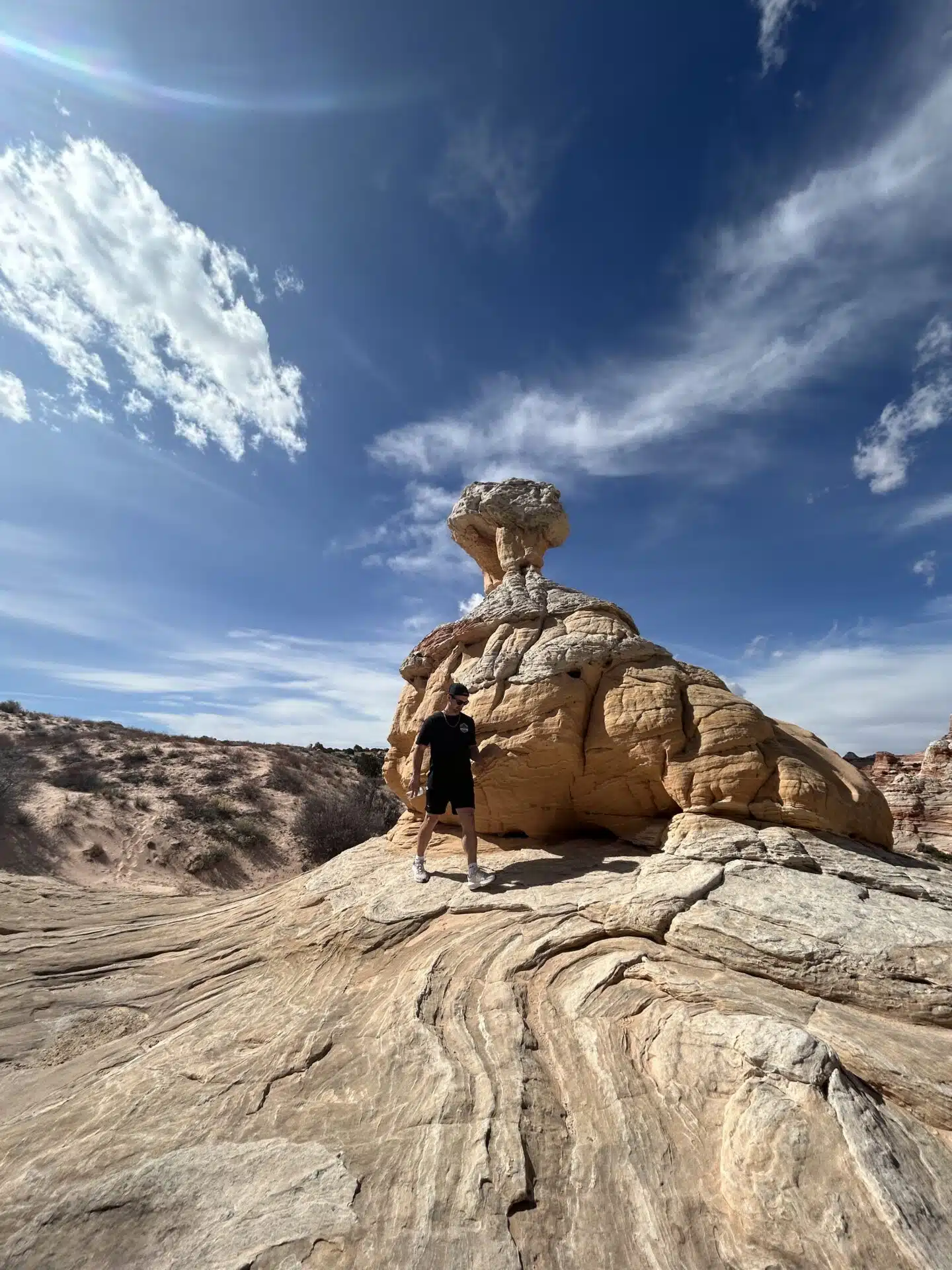 A person hiking White Pocket in southern Utah
